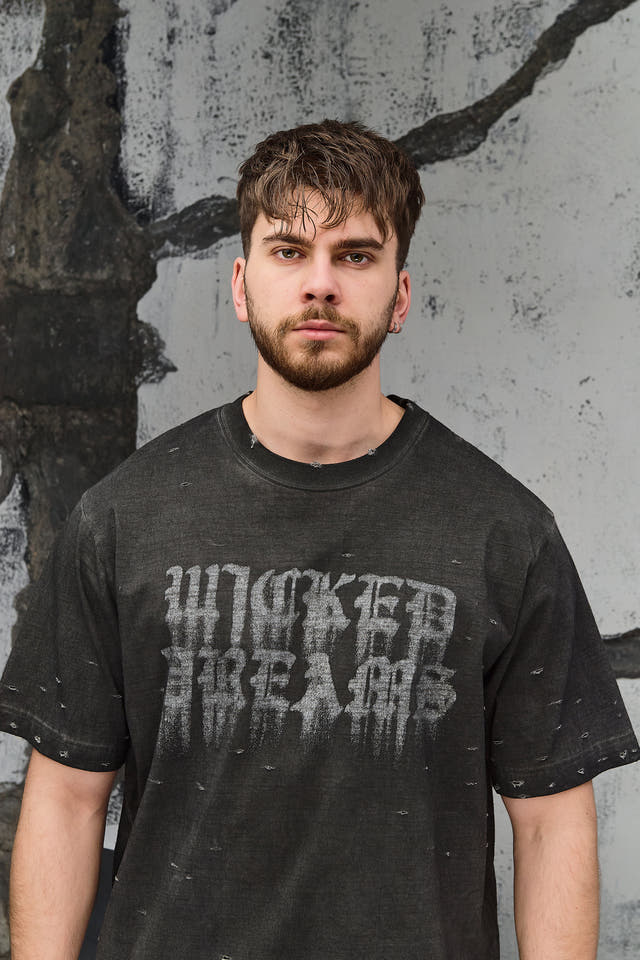 Wicked33 Burnout oversized t-shirt in dark grey / washed black, spray-effect front graphic