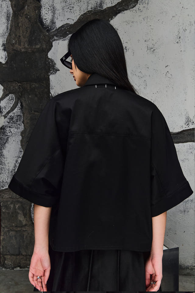Wicked33 Foreign oversized shirt in deep black, large white “FOREIGN EVERYWHERE” text print on chest and sleeve