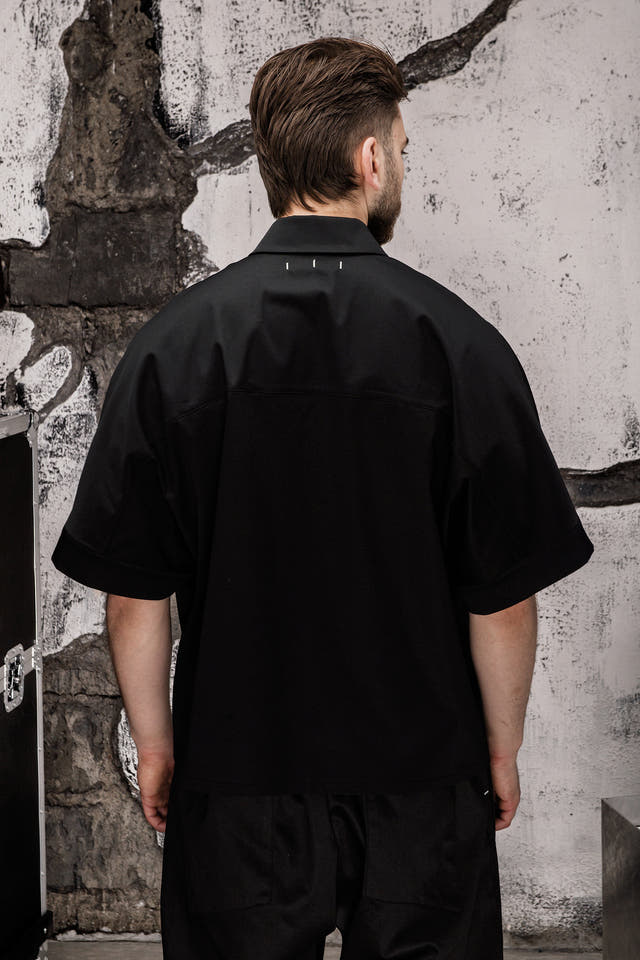 Wicked33 Foreign oversized shirt in deep black, large white “FOREIGN EVERYWHERE” text print on chest and sleeve
