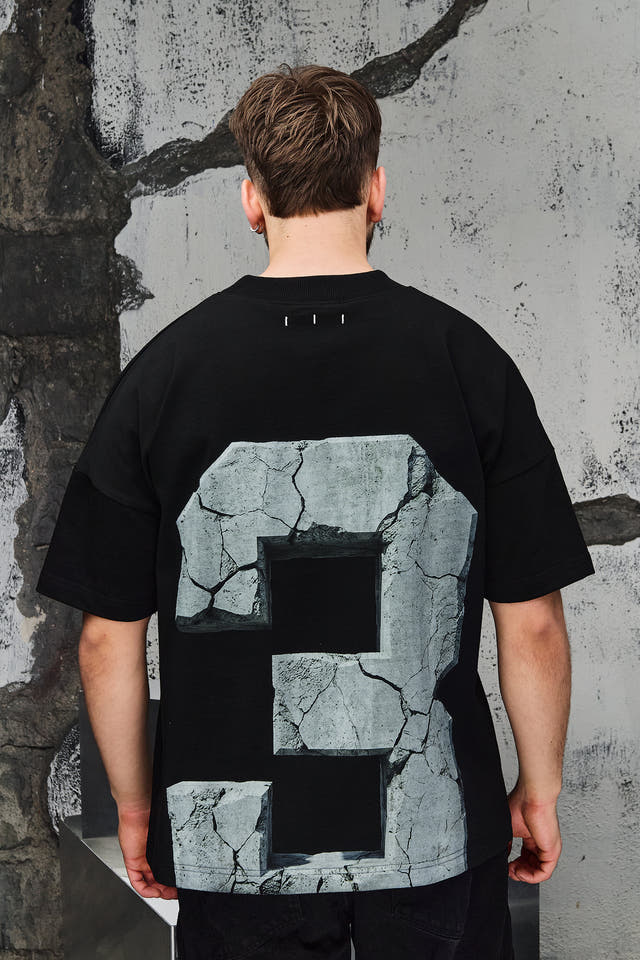 Wicked33 33:FRACTURE oversized t-shirt in black, large cracked stone graphic print with number “3”