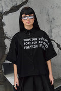 Wicked33 Foreign oversized shirt in deep black, large white “FOREIGN EVERYWHERE” text print on chest and sleeve