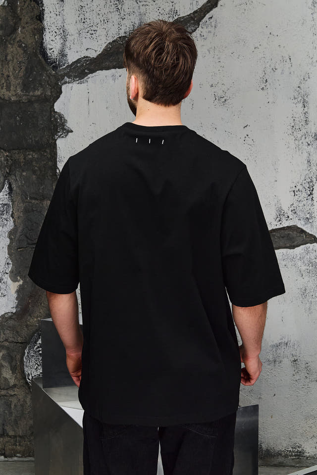 Wicked33 Alter oversized t-shirt in black, central print with doubled face effect and vintage texture