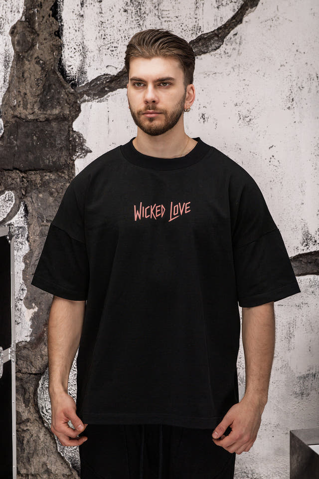 Wicked33 Divine oversized t-shirt in black, “WICKED LOVE” dusty pink text print on chest