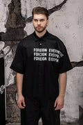 Wicked33 Foreign oversized shirt in deep black, large white “FOREIGN EVERYWHERE” text print on chest and sleeve