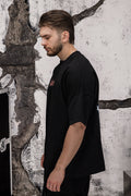 Wicked33 Divine oversized t-shirt in black, “WICKED LOVE” dusty pink text print on chest