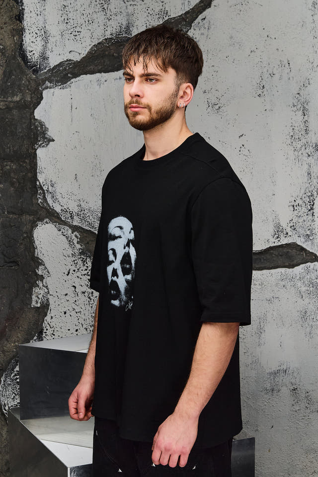Wicked33 Alter oversized t-shirt in black, central print with doubled face effect and vintage texture