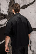 Wicked33 Foreign oversized shirt in deep black, large white “FOREIGN EVERYWHERE” text print on chest and sleeve