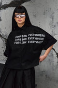 Wicked33 Foreign oversized shirt in deep black, large white “FOREIGN EVERYWHERE” text print on chest and sleeve