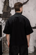 Wicked33 Foreign oversized shirt in deep black, large white “FOREIGN EVERYWHERE” text print on chest and sleeve