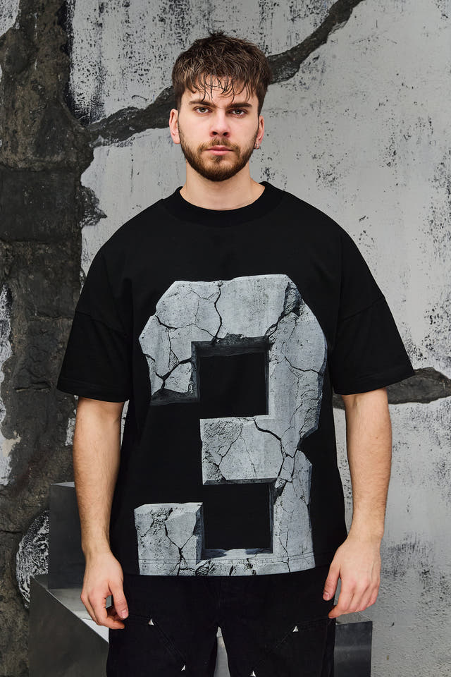 Wicked33 33:FRACTURE oversized t-shirt in black, large cracked stone graphic print with number “3”