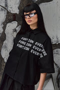 Wicked33 Foreign oversized shirt in deep black, large white “FOREIGN EVERYWHERE” text print on chest and sleeve