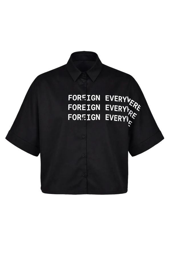 Wicked33 Foreign oversized shirt in deep black, large white “FOREIGN EVERYWHERE” text print on chest and sleeve