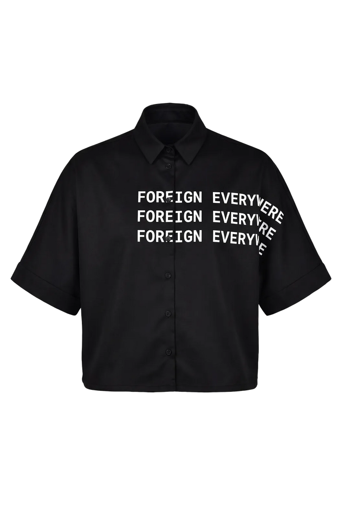 Wicked33 Foreign oversized shirt in deep black, large white “FOREIGN EVERYWHERE” text print on chest and sleeve
